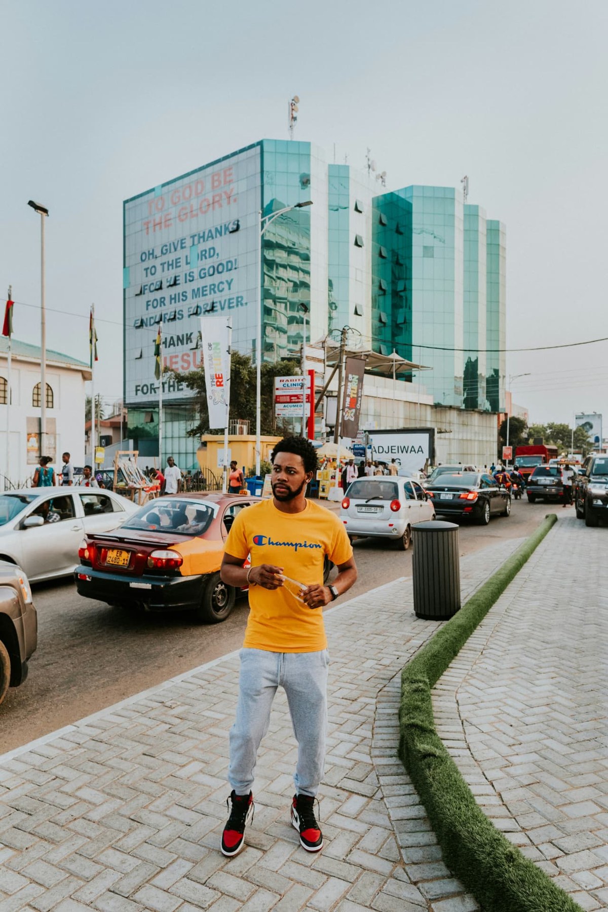 A pedestrian on a busy African city street